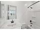 Clean, bright bathroom with white vanity, framed mirror, shower and tub combo at 9522 W Luxton Ln, Tolleson, AZ 85353
