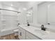 Bright bathroom featuring modern fixtures, dual sinks, and a shower-tub combination at 9522 W Luxton Ln, Tolleson, AZ 85353