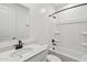 Bright bathroom featuring modern fixtures, a sleek vanity, and a shower-tub combination at 9522 W Luxton Ln, Tolleson, AZ 85353