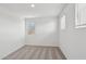 Well-lit bedroom with neutral carpet, white walls, and bright windows at 9522 W Luxton Ln, Tolleson, AZ 85353