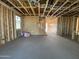 Interior framing of a new construction home with insulation, open floor plan, staircase, and exposed pipes and wiring at 9522 W Luxton Ln, Tolleson, AZ 85353