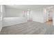 Open loft with neutral walls and carpeting, showcasing versatile living area at 9522 W Luxton Ln, Tolleson, AZ 85353