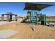 Modern playground equipment in a well-maintained community park with picnic area at 9522 W Luxton Ln, Tolleson, AZ 85353