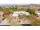 Expansive aerial view of the desert home highlighting mature landscaping and circular driveway at 9626 E Peak View Rd, Scottsdale, AZ 85262