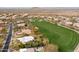 Desert home situated on a lush golf course, as seen from an aerial perspective at 9626 E Peak View Rd, Scottsdale, AZ 85262