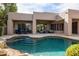 Inviting backyard featuring a large pool, patio seating, and a covered outdoor living space at 9626 E Peak View Rd, Scottsdale, AZ 85262