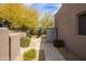 Private backyard with stone pathway, desert plants, and storage unit at 9626 E Peak View Rd, Scottsdale, AZ 85262