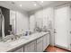Bright bathroom featuring dual sinks, granite countertops, and modern fixtures at 9626 E Peak View Rd, Scottsdale, AZ 85262