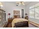 Comfortable bedroom with a large bed, cozy decor, and ample natural light at 9626 E Peak View Rd, Scottsdale, AZ 85262