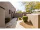 Charming private courtyard with neutral tones, decorative stone, and manicured landscaping at 9626 E Peak View Rd, Scottsdale, AZ 85262