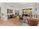 Open-concept space featuring hardwood floors, large windows and desert views at 9626 E Peak View Rd, Scottsdale, AZ 85262