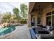 Inviting backyard with sparkling pool and comfortable outdoor seating area at 9626 E Peak View Rd, Scottsdale, AZ 85262