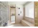 The stand up shower features glass block wall and built in bench at 9626 E Peak View Rd, Scottsdale, AZ 85262