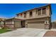 Beautiful home featuring a two-car garage, tile roof, and desert landscaping at 11728 W Villa Hermosa N Ln, Sun City, AZ 85373