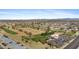 Overhead view of Sun City West, Arizona, showcases lush golf courses, homes, clubhouse, and scenic desert landscapes at 12814 W Shadow Hills Dr, Sun City West, AZ 85375
