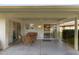 Covered patio with comfortable seating, offering a relaxed outdoor living space and a view at 12814 W Shadow Hills Dr, Sun City West, AZ 85375