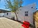 Backyard of home features a colorful tiled doorway, mature tree, and clean exterior siding at 1541 W Culver St, Phoenix, AZ 85007