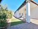 The backyard has an inviting outdoor space with a covered patio and a neat lawn at 1541 W Culver St, Phoenix, AZ 85007