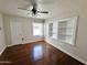 This bedroom offers recessed shelving, ceiling fan, and a bright window for natural light at 1541 W Culver St, Phoenix, AZ 85007
