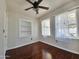 Well-lit bedroom with a built-in bookshelf and light filtering window coverings at 1541 W Culver St, Phoenix, AZ 85007