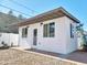 Detached building with white exterior, multiple windows, and a separate entrance at 1541 W Culver St, Phoenix, AZ 85007