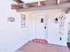 Covered porch with decorative tile flooring and a unique wind chime at 1541 W Culver St, Phoenix, AZ 85007