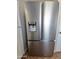 Stainless steel refrigerator with a water dispenser and a freezer drawer at 1541 W Culver St, Phoenix, AZ 85007