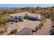 Expansive desert home featuring a three-car garage and desert landscaping at 16141 E Thistle Dr, Fountain Hills, AZ 85268