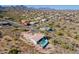 Aerial view of the home showing desert landscaping, pool, and a covered patio at 16141 E Thistle Dr, Fountain Hills, AZ 85268