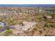 Aerial view of the home showing desert landscaping, tile roof, and a large multi-car driveway at 16141 E Thistle Dr, Fountain Hills, AZ 85268