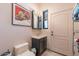 This bathroom is a half bath with a toilet and sink, and some unique decorative elements at 16141 E Thistle Dr, Fountain Hills, AZ 85268