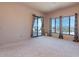 Bright, carpeted bedroom with balcony access and beautiful views at 16141 E Thistle Dr, Fountain Hills, AZ 85268
