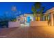 Quaint desert home with block wall, gated front entrance, and desert landscaping at 16141 E Thistle Dr, Fountain Hills, AZ 85268