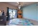 Versatile flex room with a ceiling fan, glass sliding doors and view to the exterior at 16141 E Thistle Dr, Fountain Hills, AZ 85268