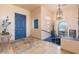Bright foyer featuring neutral walls, decorative accents, and a striking blue front door at 16141 E Thistle Dr, Fountain Hills, AZ 85268