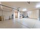 Spacious garage with epoxy flooring, ample storage cabinets, and multiple access doors at 16141 E Thistle Dr, Fountain Hills, AZ 85268