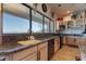 Well-lit kitchen offers granite countertops, stainless steel appliances, and scenic views at 16141 E Thistle Dr, Fountain Hills, AZ 85268