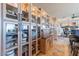 Kitchen featuring custom cabinets with glass fronts, adjacent to dining area at 16141 E Thistle Dr, Fountain Hills, AZ 85268