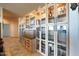Kitchen featuring custom cabinets with glass fronts and integrated lighting at 16141 E Thistle Dr, Fountain Hills, AZ 85268