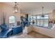 Open-concept living room with a view, unique blue accents, and tiled floors at 16141 E Thistle Dr, Fountain Hills, AZ 85268
