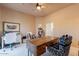 Comfortable office space with a large desk and plenty of natural light at 16141 E Thistle Dr, Fountain Hills, AZ 85268