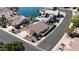 Aerial view of home with solar panels, desert landscaping, near waterfront, and tile roof at 20626 N 55Th Ave, Glendale, AZ 85308