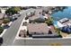 Aerial view of home with desert landscaping, white fence, near waterfront, and tile roof at 20626 N 55Th Ave, Glendale, AZ 85308