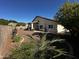 Large backyard with gravel landscaping, patio, and privacy wall offering a peaceful outdoor space at 20626 N 55Th Ave, Glendale, AZ 85308