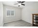 Bedroom featuring a ceiling fan, window, and light gray flooring throughout the room at 20626 N 55Th Ave, Glendale, AZ 85308