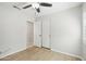 Bedroom with light wood flooring, ceiling fan, and sliding closet doors at 20626 N 55Th Ave, Glendale, AZ 85308