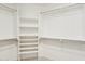Walk-in closet with built-in shelves, rods, and ample storage space for organization at 20626 N 55Th Ave, Glendale, AZ 85308