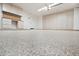 Garage with epoxy flooring, custom cabinets, and workspace at 20626 N 55Th Ave, Glendale, AZ 85308
