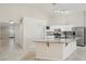 Spacious kitchen featuring white cabinets, granite countertops, and stainless steel appliances at 20626 N 55Th Ave, Glendale, AZ 85308