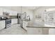 Bright kitchen featuring white cabinets, stainless steel appliances, and a center island at 20626 N 55Th Ave, Glendale, AZ 85308